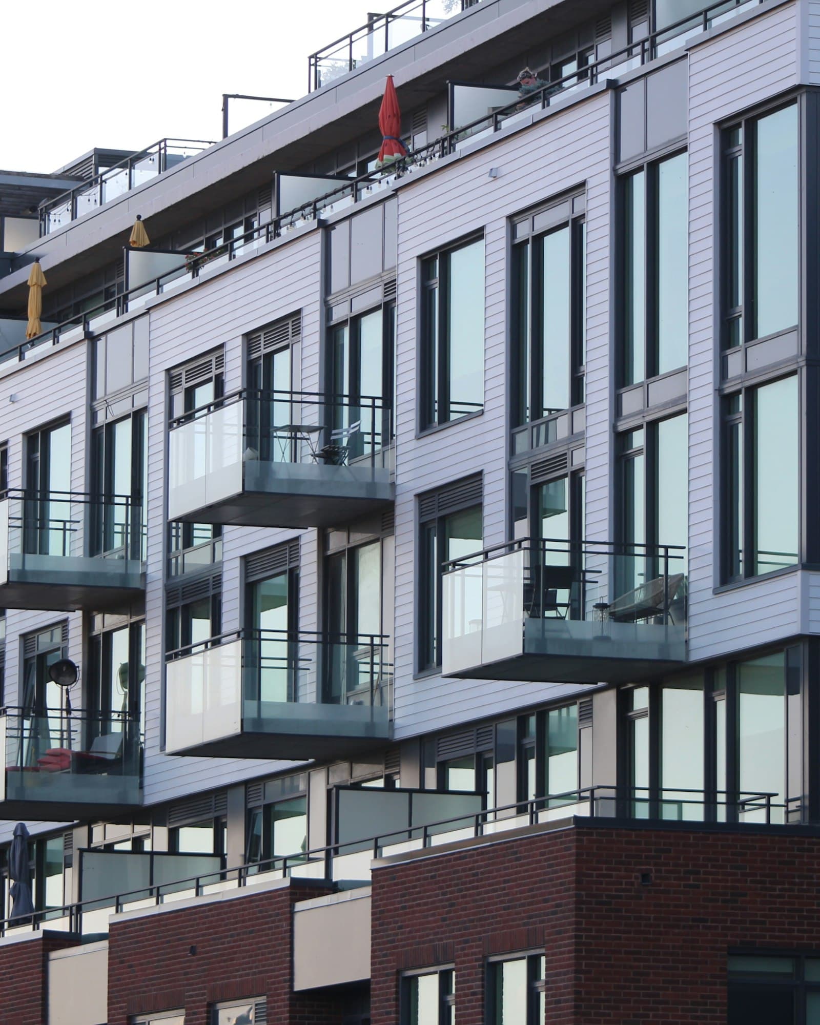 Contemporary apartment building facade in concrete and glass, daylight